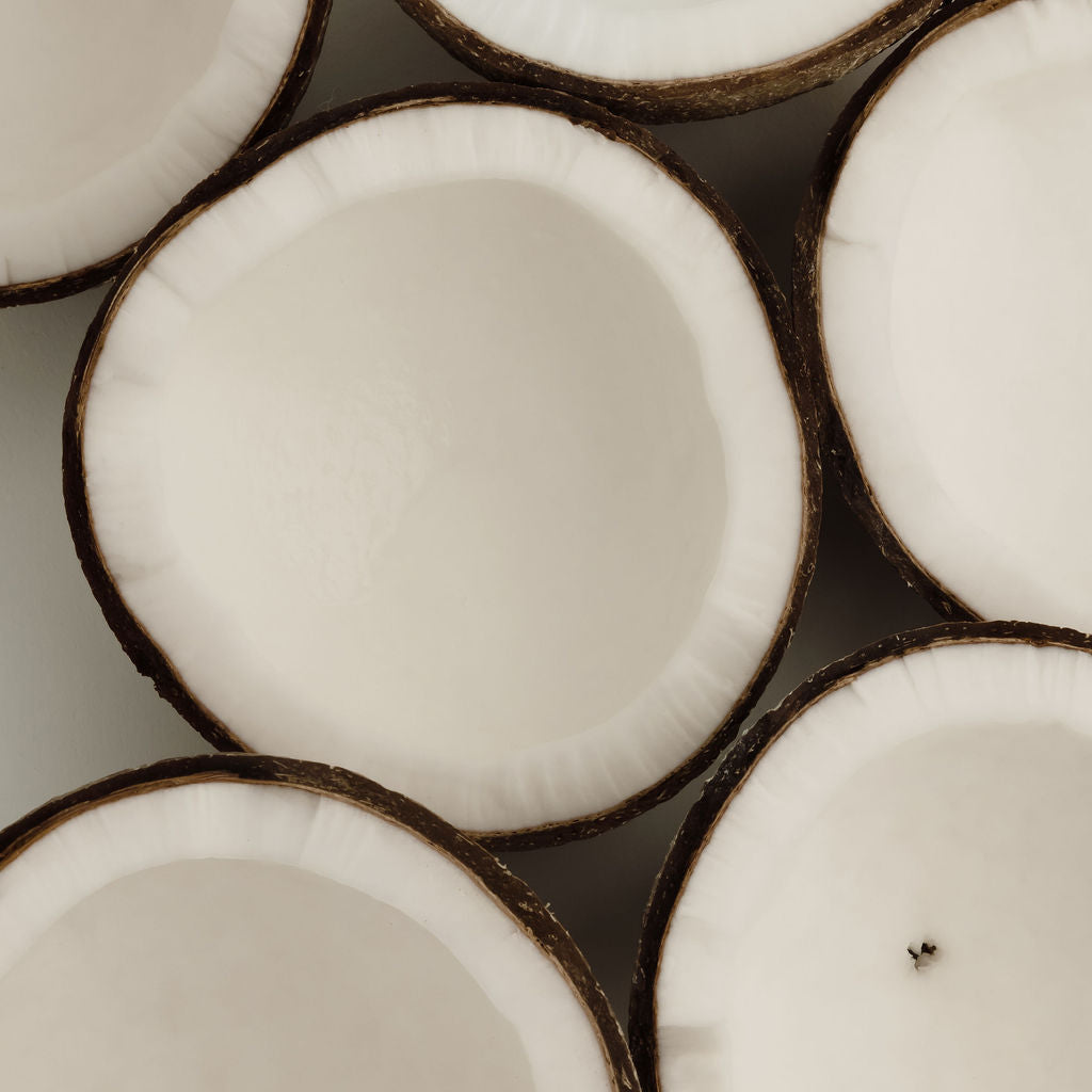 Close-up of coconut halves arranged in a pattern
