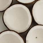 Close-up of coconut halves arranged in a pattern