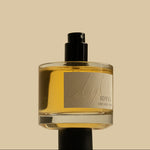 Bottle of Idyll perfume on a beige background